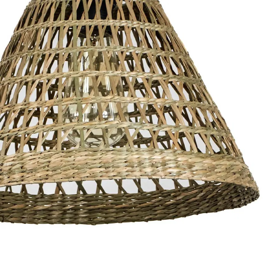 Closeup of woven rattan lamp shade showcasing handcrafted texture and rustic artisan details.