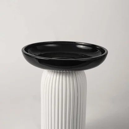 Black and white ceramic decorative vase with fluted base for tabletop styling and luxury modern home decor.