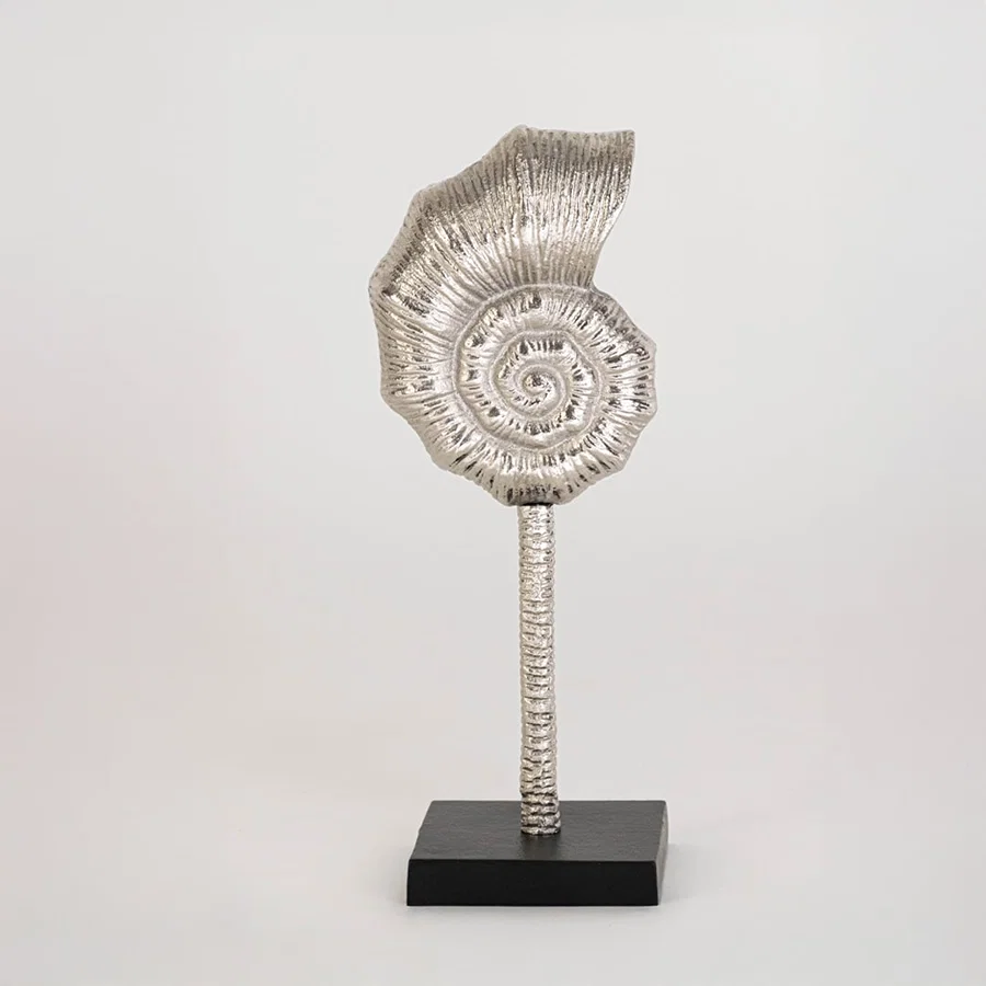 Decorative silver spiral sculpture on a black stand displayed against a clean white background showing its textured artistic design