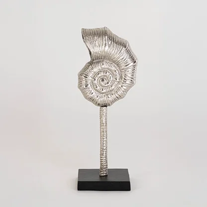 Modern silver swirl accent piece on a sturdy black base photographed on a white background highlighting its elegant handcrafted finish