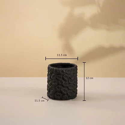Small round black textured ceramic vase measuring 12 cm in height and 11.5 cm in width displayed on white background.