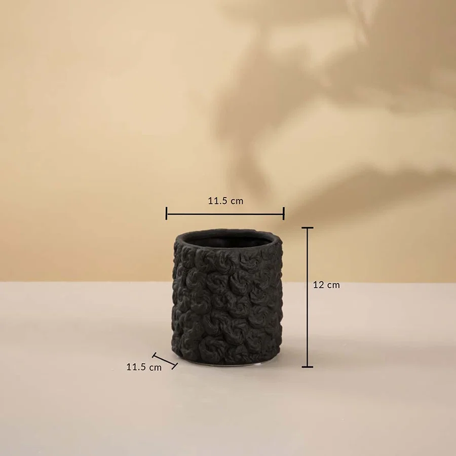 Small round black textured ceramic vase measuring 12 cm in height and 11.5 cm in width displayed on white background.