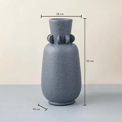 Grey ceramic vase with speckled design 33 cm height and 18 cm width ideal for table decor and home styling.