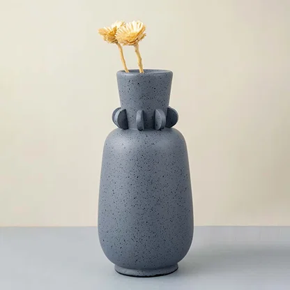 Sasa sculpture vase on white background featuring artistic ceramic form smooth surface and statement design for modern interior decor styling.