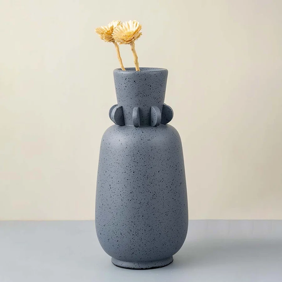 Sasa sculpture vase on white background featuring artistic ceramic form smooth surface and statement design for modern interior decor styling.