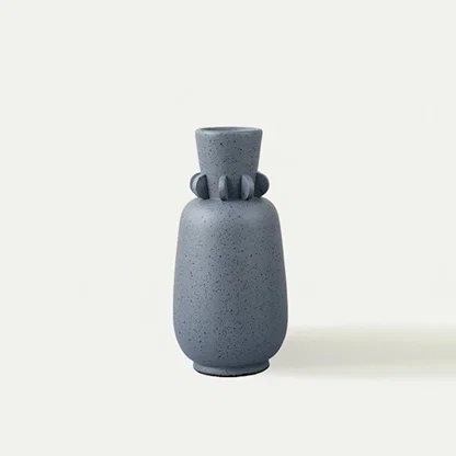 Grey ceramic decorative vase with stacked sculptural silhouette for tabletop styling and modern home decor displays.