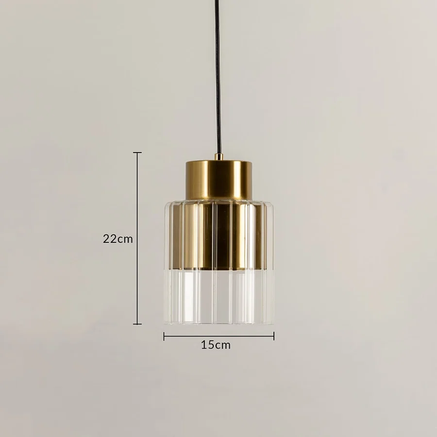 Gold metal and clear glass pendant light dimension image with 15 cm width and 22 cm height for bedside placement.