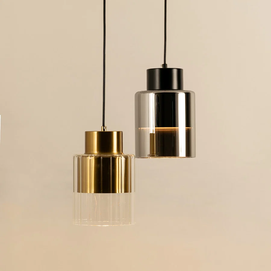 Elegant gold and silver pendant lights suspended for luxury modern interior and dining room decor styling.