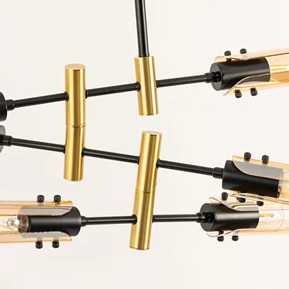 Black and gold metal chandelier showcasing premium metal craftsmanship and exposed bulb details for modern decor.