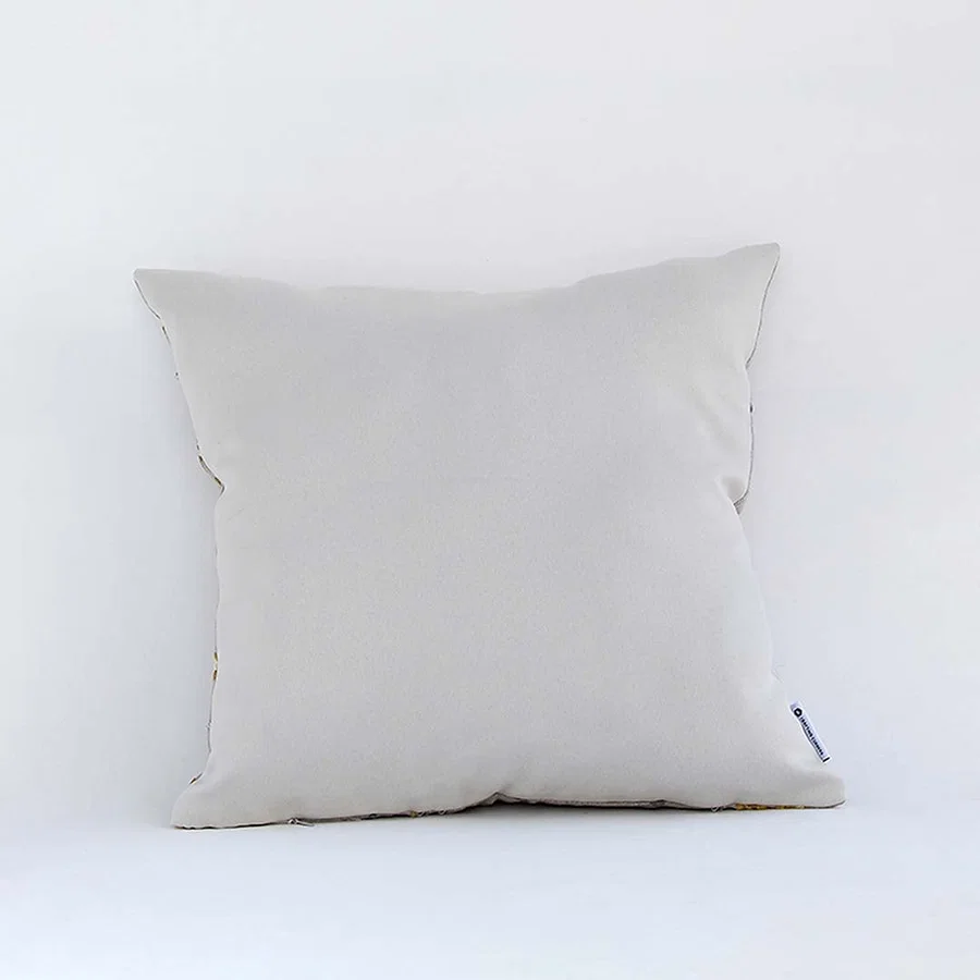 Back view of cotton cushion featuring blue floral embroidered motifs showing soft plush fabric and fine stitching ideal for sofa and bed styling.