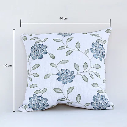 Cotton cushion with blue floral embroidered design measured at 40 cm by 40 cm displayed on a white background showing its square decorative shape.