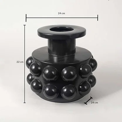 Black ceramic vase measuring 22 cm in height and 24 cm in width featuring a glossy spherical textured surface.