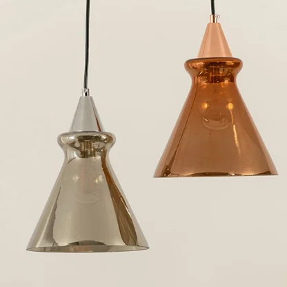 Silver and copper glass pendant lights illuminated to showcase premium decorative ceiling lighting with artistic appeal.