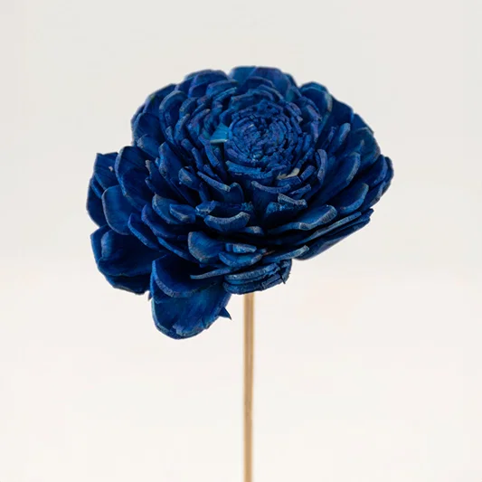 A single royal blue handmade sola wood flower stem isolated on white background for luxury modern tabletop vase decoration.