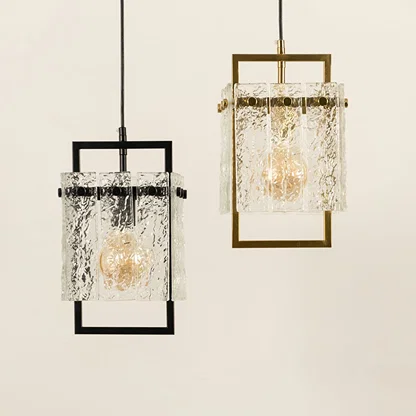 Black and gold metal wall lights illuminated to display elegant crystal detailing and contemporary lighting appeal.