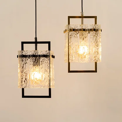 Black and gold metal wall lights with crystal accents illuminated to display sophisticated decorative lighting appeal.