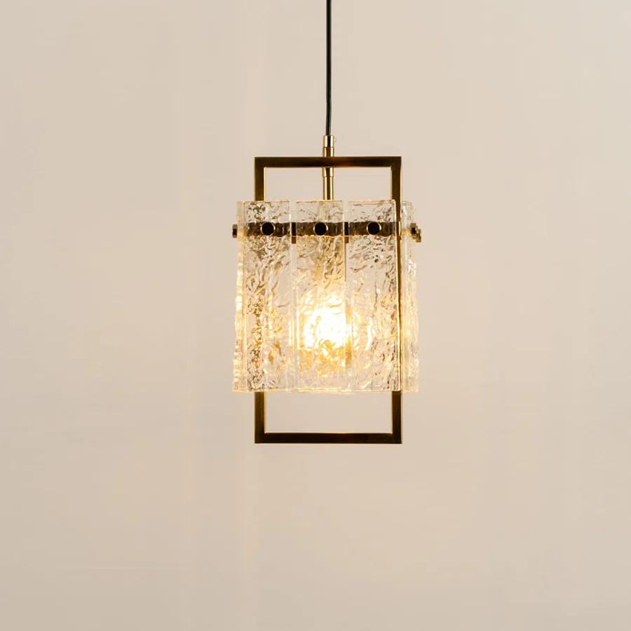 Gold metal wall light with crystal glass accents illuminated to showcase premium decorative wall lighting elegance.