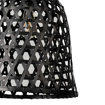 Detailed view of black perforated metal pendant light highlighting textured pattern and artisan design.