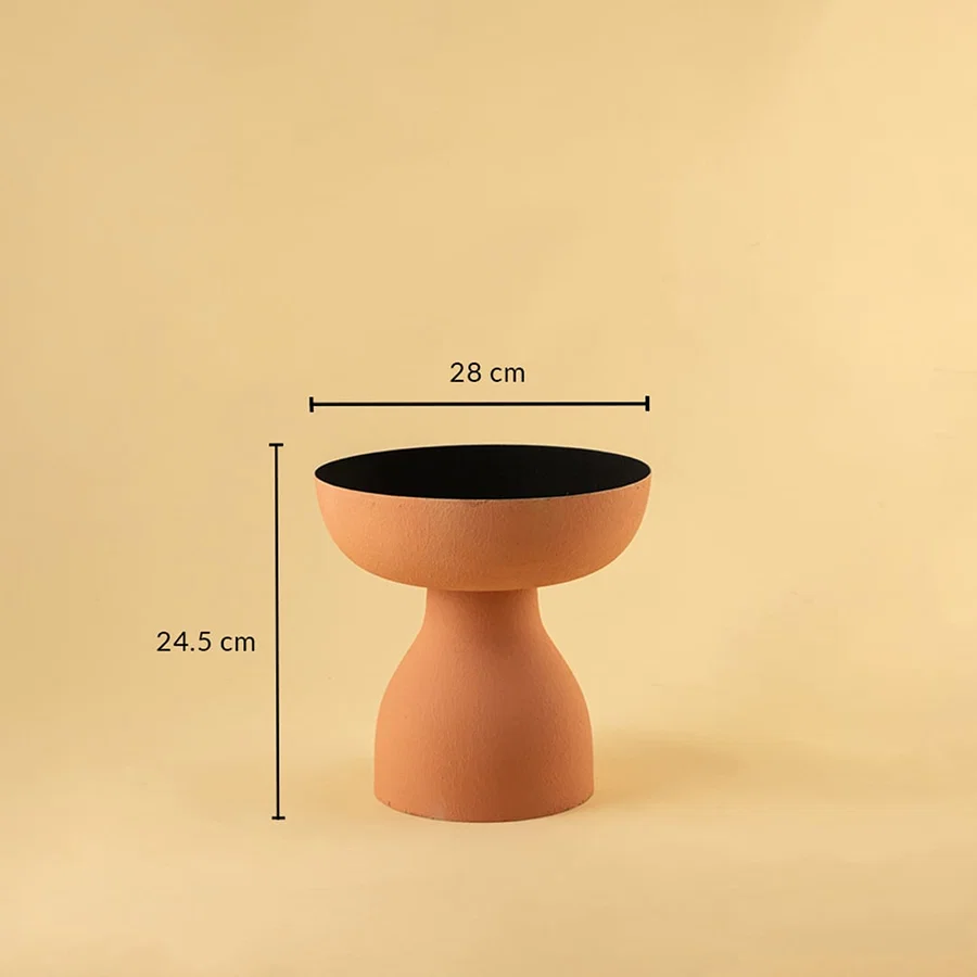 Terracotta orange pedestal bowl with black interior shown with 28 cm width and 24.5 cm height for modern artistic home decor.