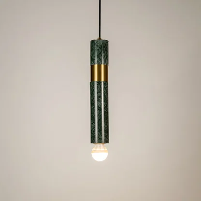 Green metal tube pendant light illuminated to showcase modern decorative ceiling lighting with elegant contemporary styling.