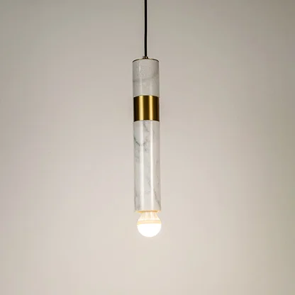 Clear glass and gold metal tube pendant light illuminated to showcase elegant modern ceiling lighting design.