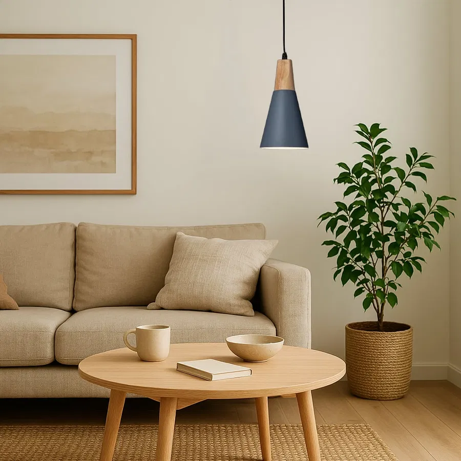 Blue metal pendant light above coffee table adding Scandinavian elegance and warm ambient lighting to modern interiors.