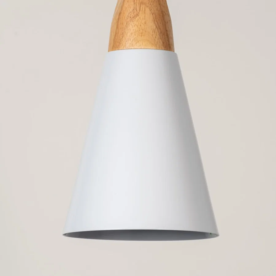 White metal pendant light with natural wood accents showcasing sleek cone shape and modern Scandinavian style.