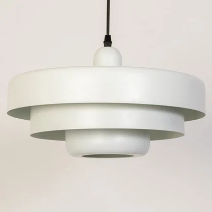 Closeup pendant light in white metal finish with layered shade design for kitchen or dining decor lighting white background.