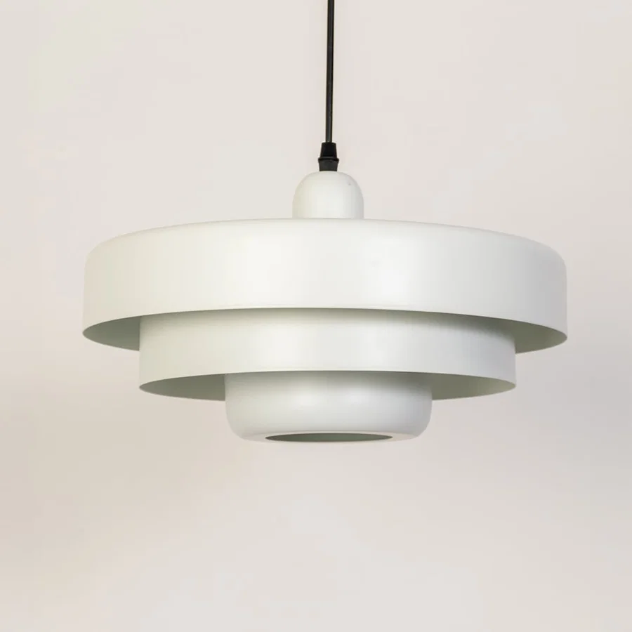 White metal pendant light with layered shade design for kitchen dining room and modern interiors.