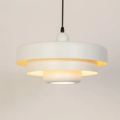 White metal pendant light with warm glow ideal for bedroom dining room and ceiling decor.