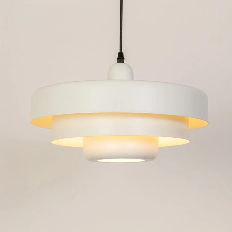 White metal pendant light with warm glow ideal for bedroom dining room and ceiling decor.