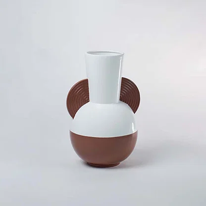 Modern white and brown bulbous ceramic vase accented with decorative wood textured half disc side handles for art decor.