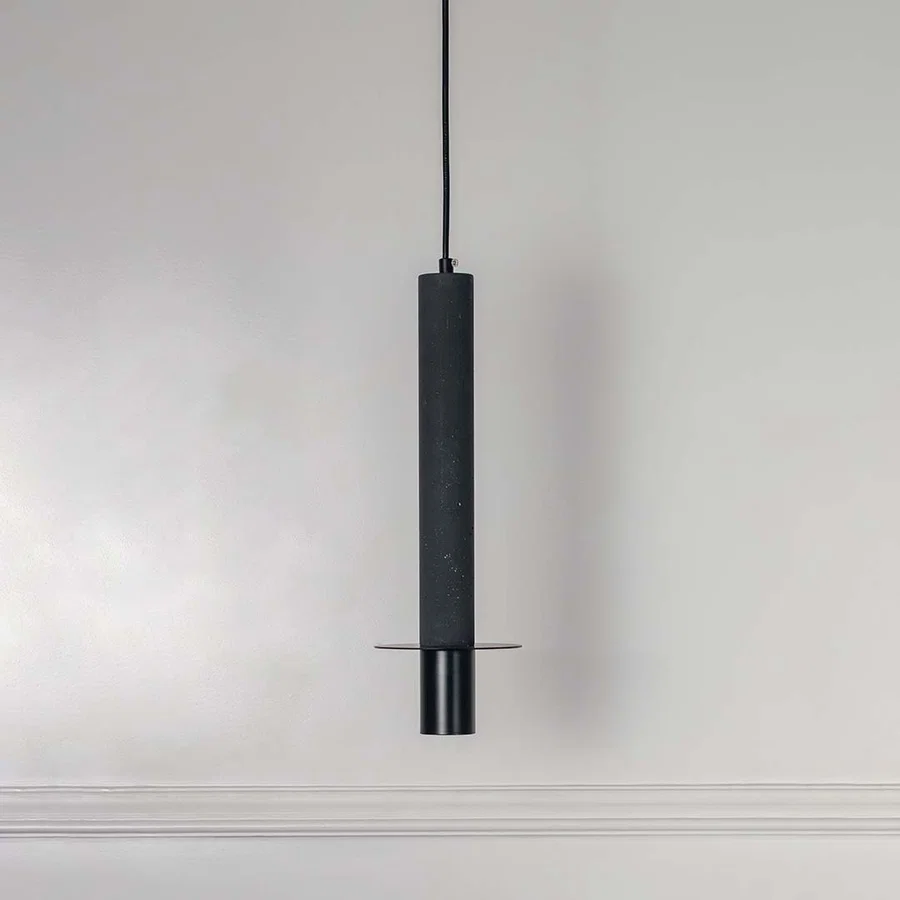 Black cylindrical metal pendant light with polished silver accents crafted for elegant interiors.