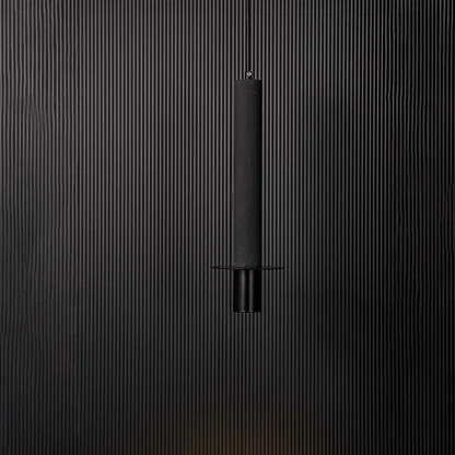 Black cylindrical pendant ceiling light glowing softly against black background creating a modern and elegant interior style.