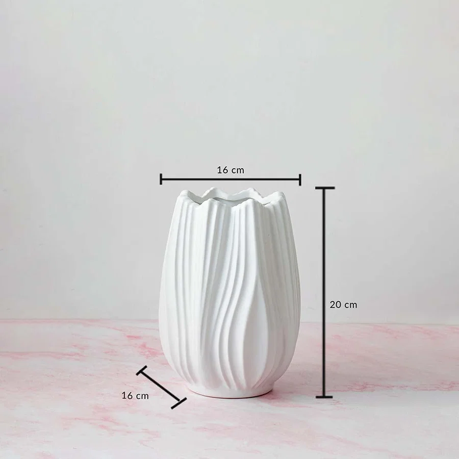 White textured vase with 20 cm height and 16 cm width displayed with measurements on a pink base.