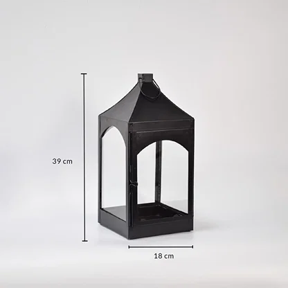 Tall black metal lantern with pointed top showing 50 cm height and 20 cm width dimensions designed for statement floor decor styling.