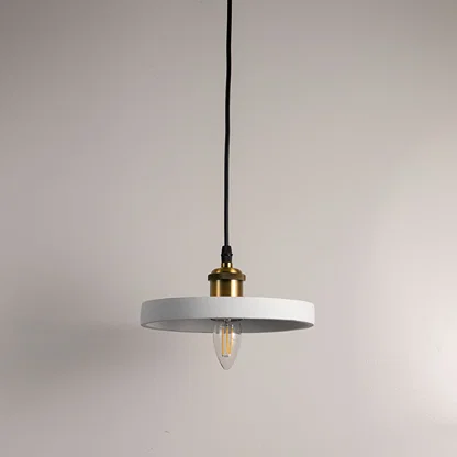 Minimalist black metal pendant light with gold fittings designed for contemporary interiors.