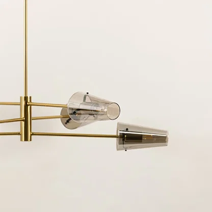 Clear glass shade chandelier with gold metal detailing showcasing premium craftsmanship and modern decorative lighting.