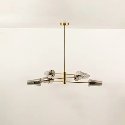 Clear glass shade chandelier with gold metal frame designed for elegant modern ceiling lighting in contemporary interiors.