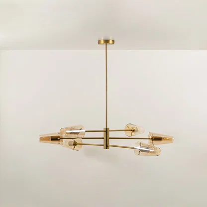Clear glass shade chandelier with gold metal frame designed for elegant modern ceiling lighting in stylish interiors.