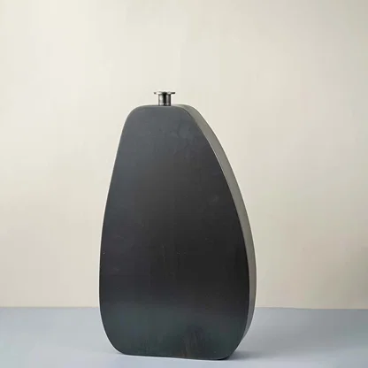 Charcoal grey ceramic decorative vase with organic silhouette for contemporary tabletop styling and home decor displays.