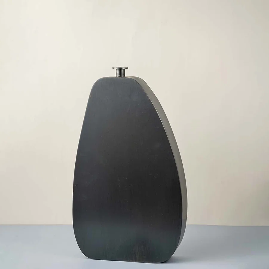 Charcoal grey ceramic decorative vase with organic silhouette for contemporary tabletop styling and home decor displays.