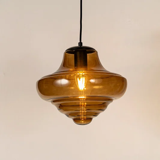 Amber ribbed glass pendant light with layered glass design and exposed bulb for elegant modern ceiling lighting.