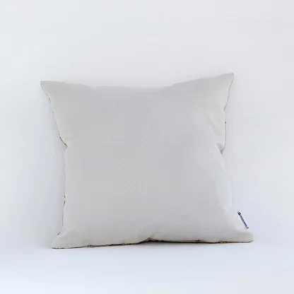 Back side view of white cushion cover showing clean seams soft fabric finish and concealed closure for neat styling.