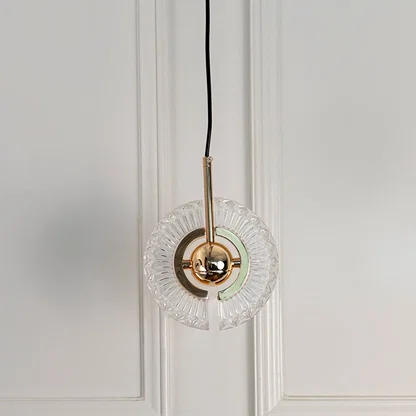 Modern crystal pendant light with polished gold accents designed for sophisticated living spaces.