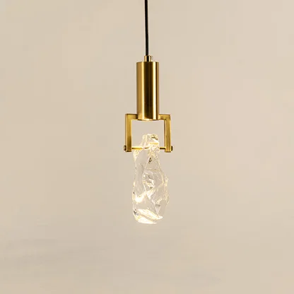 Elegant gold metal pendant light with crystal bulb holder for stylish kitchen and luxury interior decor styling.