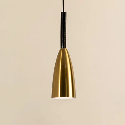 Gold metal cone pendant light illuminated to display sleek modern ceiling lighting with luxury decorative elegance.