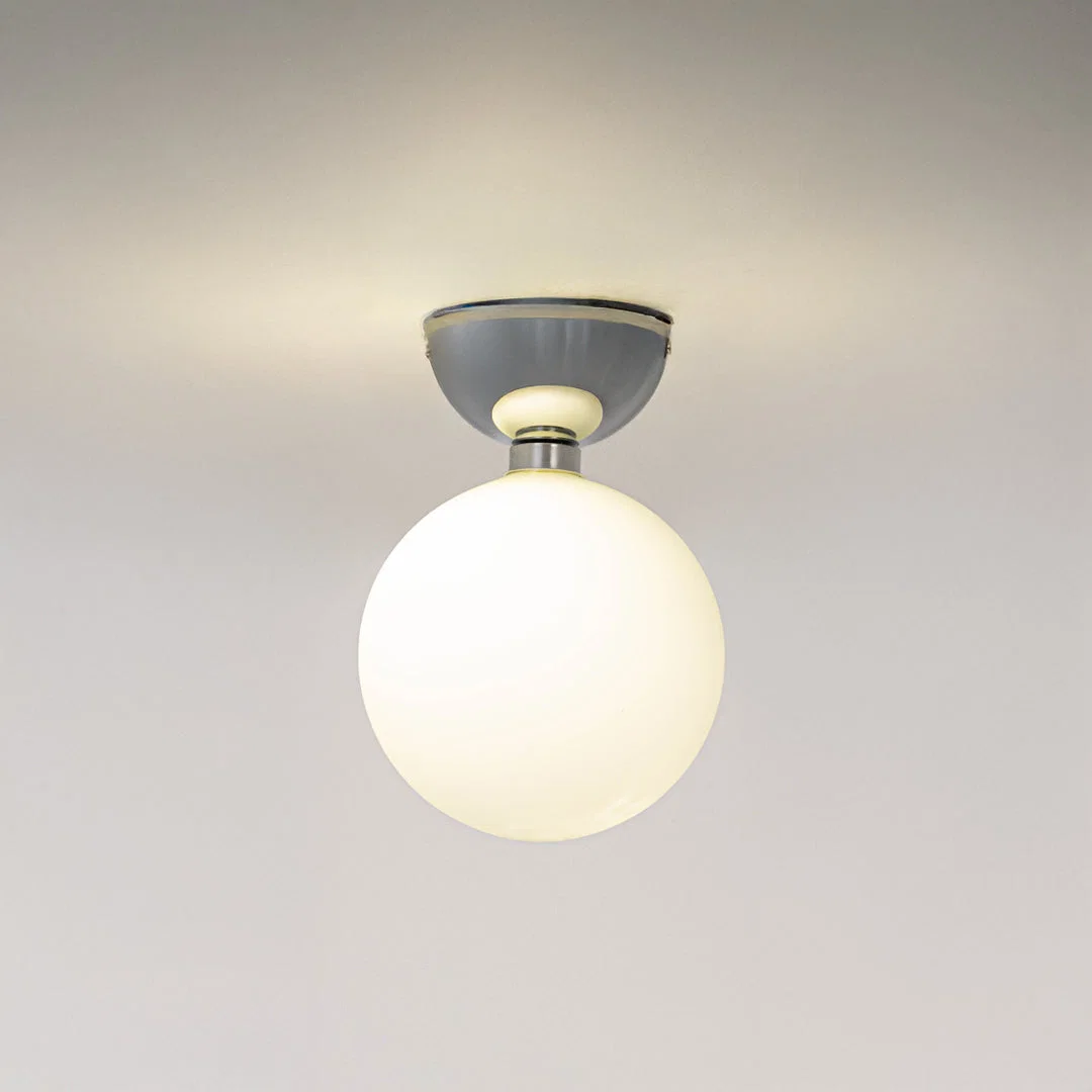 Modern grey metal ceiling light with frosted white glass globe for stylish hallway and minimalist decor spaces.