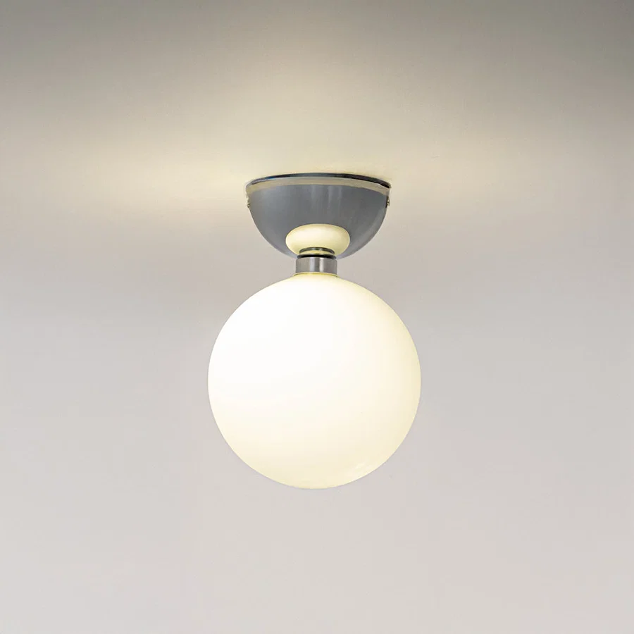 Modern grey metal ceiling light with frosted white glass globe for stylish hallway and minimalist decor spaces.