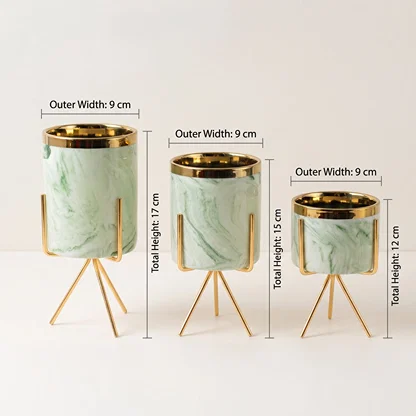 Mini marble planter on gold tripod stand showing dimensions 8 cm width and 5.5 cm height  displayed on a clean white marble background.
